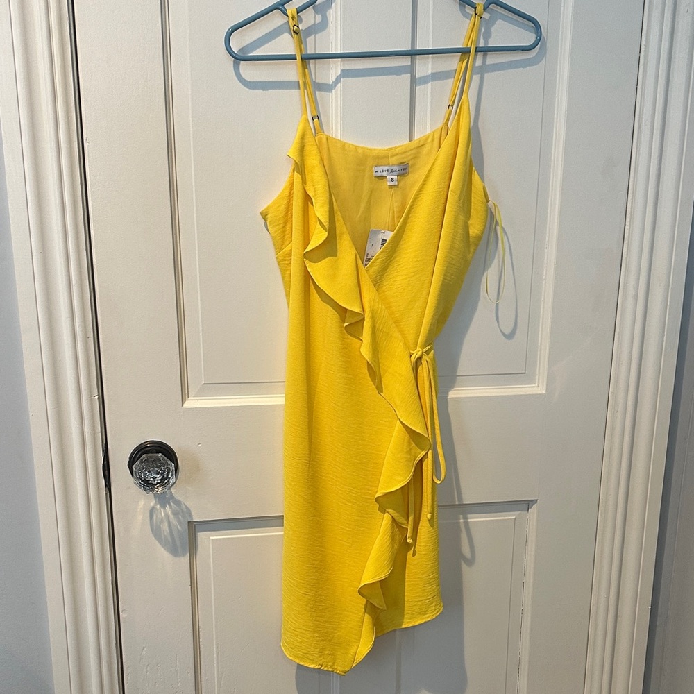 Ruffles yellow wrap mini dress.